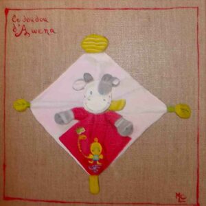 tableau d'un doudou rouge et blanc en toile de lin