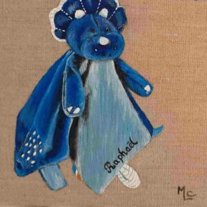 tableau d'un doudou bleu en toile de lin